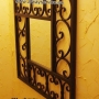 Specchio decorato in ferro battuto